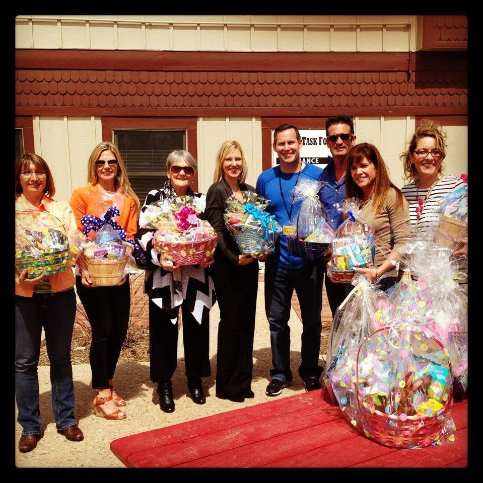 Anne Barrington and Parker Task Force volunteers holding Easter baskets