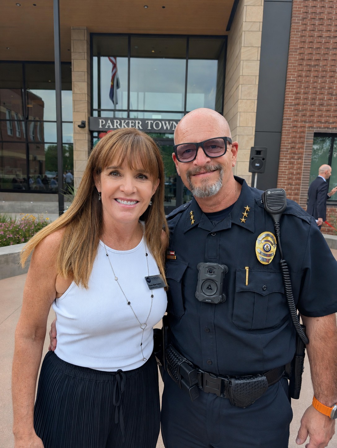 Anne Barrington with the Parker Police Chief outside Parker Town Hall